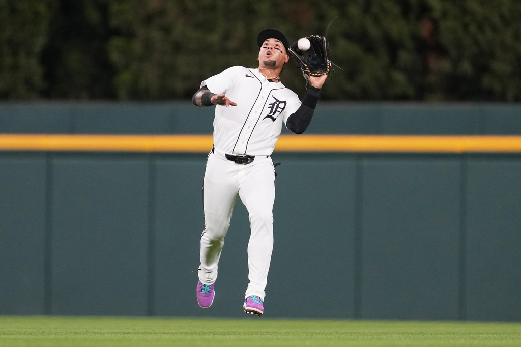Detroit Tigers center fielder Javier Báez (28) catches a Kansas City Royals' Starling Marte fly ball during the ninth inning of a baseball game Tuesday, April 14, 2026, in Detroit. (AP Photo/Paul Sancya)