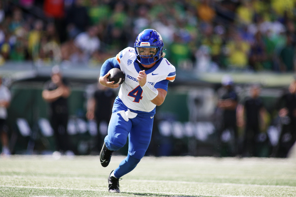 Boise State quarterback Maddux Madsen (4) runs the ball during the first half of an NCAA college football game against Oregon, Saturday, Sept. 5, 2026, in Eugene, Ore. (AP Photo/Lydia Ely)