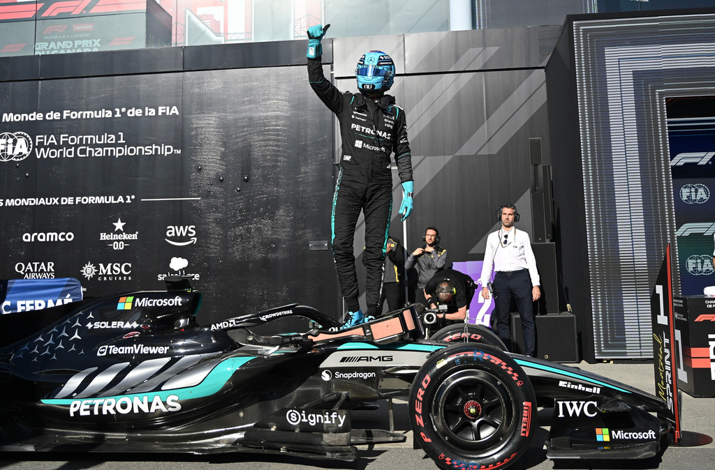Mercedes driver George Russell of Britain celebrates after taking pole following the sprint qualifying session at the F1 Canadian Grand Prix auto race in Montreal, Friday, May 22, 2026. (Graham Hughes/The Canadian Press via AP)