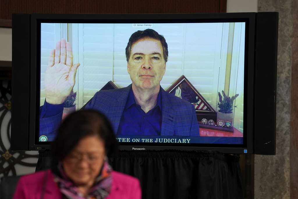 FILE - Former FBI director James Comey is sworn in before testifying via videoconference during a Senate Judiciary Committee hearing on Capitol Hill in Washington, Sept. 30, 2020. (Stefani Reynolds/Pool via AP, File)