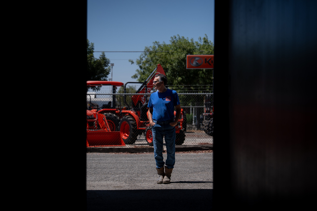 Scott Alcoser, a parts manager at a farm equipment retailer, stands for a photo in Hanford, Calif., Friday, Aug. 21, 2026. (AP Photo/Jae C. Hong)