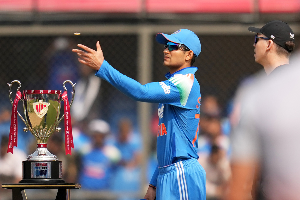 India's captain Shubman Gill tosses the coin as New Zealand's captain Michael Bracewell, right, looks on before the start of the third One Day International cricket match between India and New Zealand in Indore, India, Sunday, Jan. 18, 2026. (AP Photo/Rafiq Maqbool)
