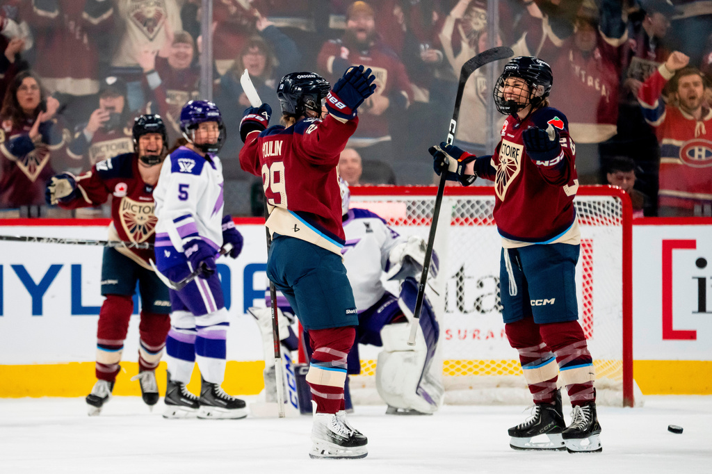 Montreal Victoire's Catherine Dubois (right) celebrates her goal with Marie-Philip Poulin (29) after scoring against the Minnesota Frost during first period of an PWHL playoff hockey game in Laval, Que., on Tuesday, May 12, 2026. (Christopher Katsarov/The Canadian Press via AP)