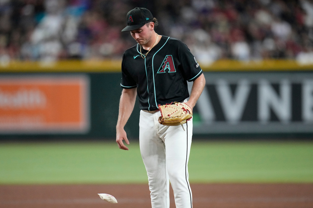 Arizona Diamondbacks starting pitcher Brandon Pfaadt tosses down the rosin bag during the fifth inning of a baseball game against the Texas Rangers, Saturday, Sept. 12, 2026, in Phoenix. (AP Photo/Ross D. Franklin)