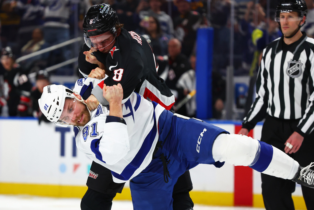 Buffalo Sabres defenseman Michael Kesselring (8) and Tampa Bay Lightning defenseman Erik Cernak (81) fight during the second period of an NHL hockey game, Sunday, March 8, 2026, in Buffalo, N.Y. (AP Photo/Jeffrey T. Barnes)