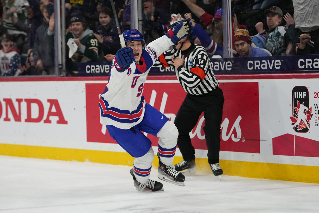 United States forward Brendan McMorrow, left, celebrates after scoring during the second period of an IIHF World Junior Hockey Championship game against Slovakia, Monday, Dec. 29, 2025, in St. Paul, Minn. (AP Photo/Abbie Parr)