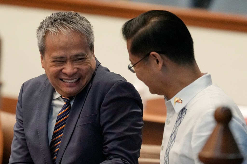 Senator Joel Villanueva, left, reacts as he talks with Senator Sherwin Gatchalian at the Philippine Senate in Pasay city, Philippines on Wednesday, June 17, 2026. (AP Photo/Aaron Favila)