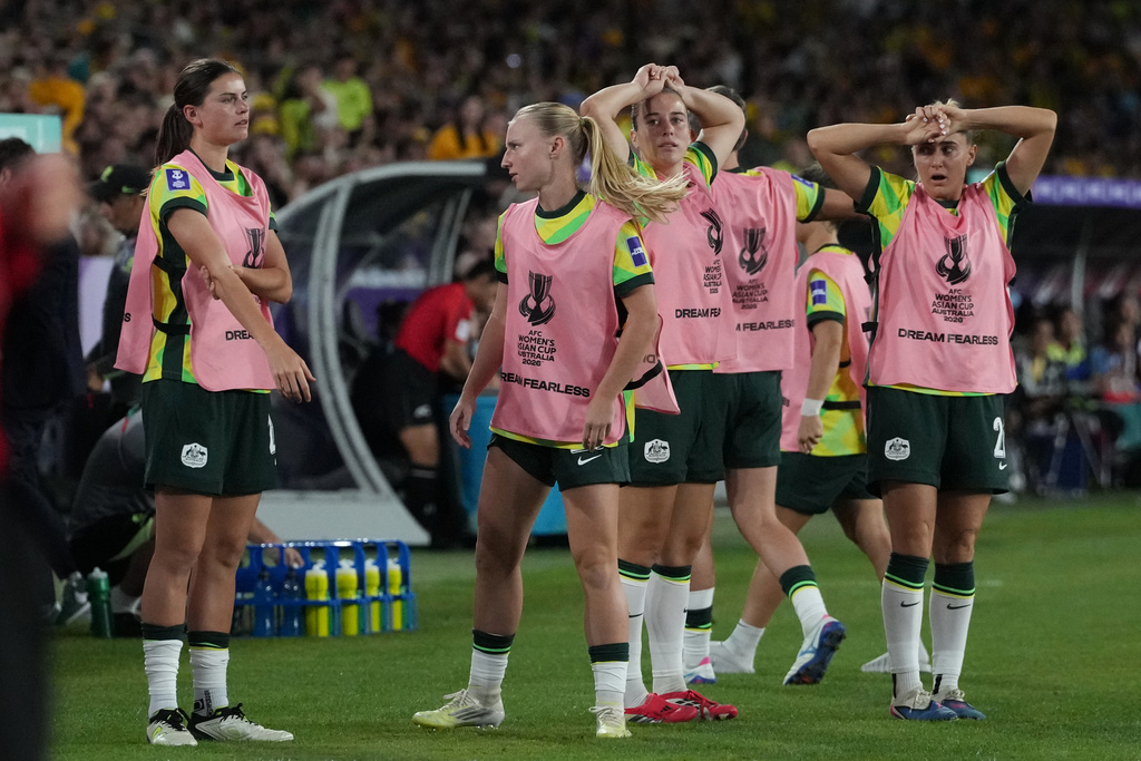 Australia's players at the bench react after a missed goal during the Women's Asian Cup soccer final between Japan and Australia in Sydney, Saturday, March 21, 2026. (AP Photo/Mark Baker)