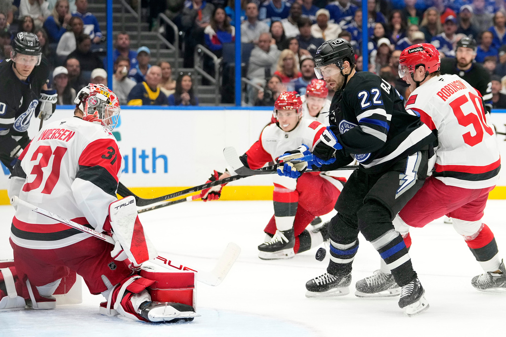 Carolina Hurricanes goaltender Frederik Andersen (31) stops a shot by Tampa Bay Lightning right wing Oliver Bjorkstrand (22) during the second period of an NHL hockey game Saturday, March 14, 2026, in Tampa, Fla. (AP Photo/Chris O'Meara)