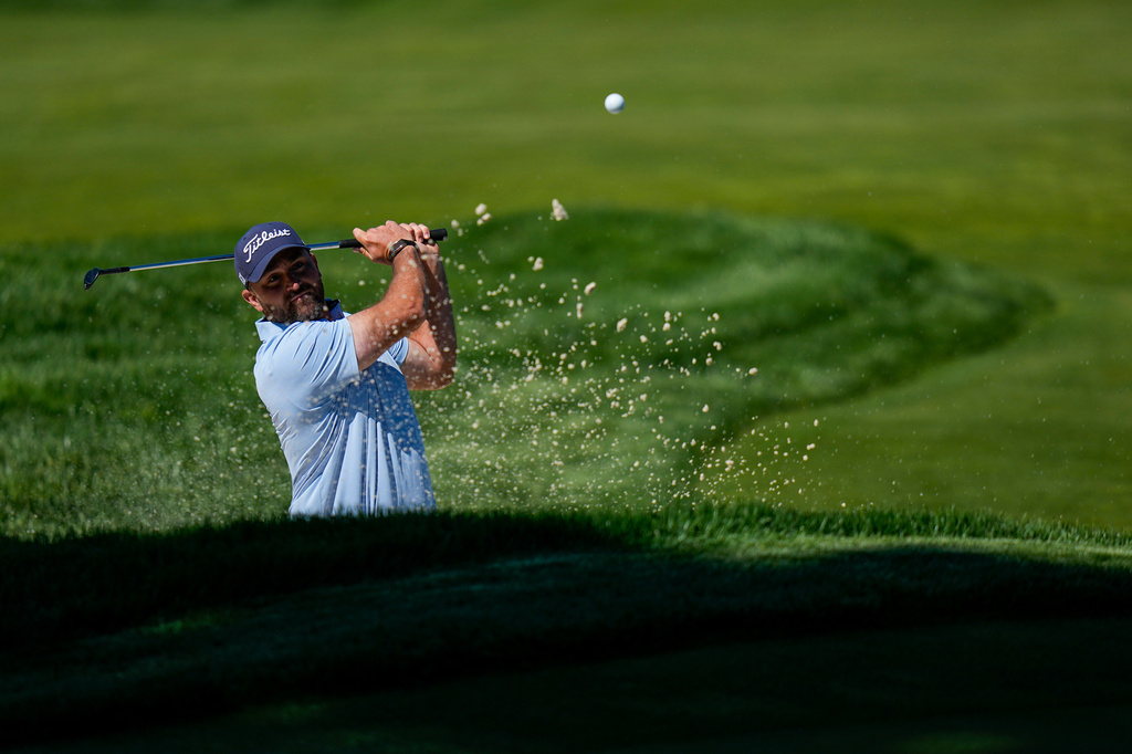 Braden Shattuck hits from the bunker during a PGA Championship golf tournament practice round at Aronimink Golf Club, Tuesday, May 12, 2026, in Newtown Square, PA. (AP Photo/Frank Franklin II)