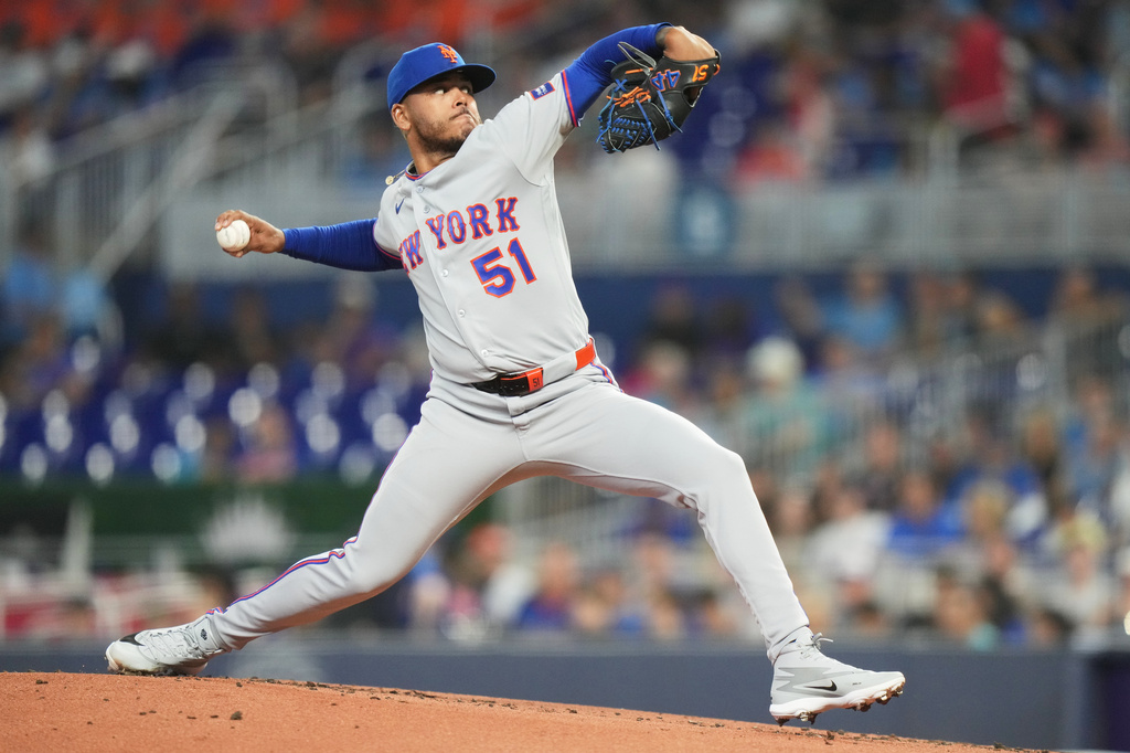 New York Mets starting pitcher Freddy Peralta throws during the first inning of a baseball game against the Miami Marlins, Saturday, May 23, 2026, in Miami. (AP Photo/Lynne Sladky)