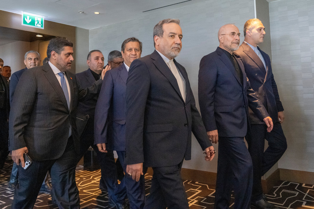 Minister of Foreign Affairs of Iran, Seyyed Abbas Araghchi, 3rd from right, and Speaker of the Islamic Parliament of Iran, Mohammed Bagher Ghalibaf, 2nd from right, with the Delegation of Iran at the Lake Lucerne Summit at the Buergenstock resort in Obbuergen, near Lucerne, Switzerland, Sunday, June 21, 2026. (Urs Flueeler, Pool Photo via AP)