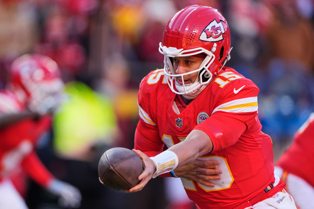 FILE - Kansas City Chiefs quarterback Patrick Mahomes hands off the ball during the second half of an NFL football game against the Los Angeles Chargers, Dec. 14, 2025, in Kansas City, Mo. (AP Photo/Charlie Riedel, File)