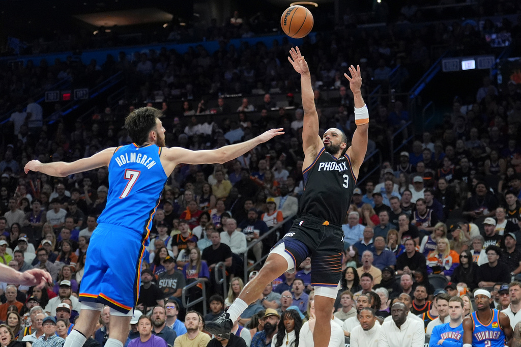 Phoenix Suns forward Dillon Brooks (3) shoots over Oklahoma City Thunder center Chet Holmgren (7) during the first half of Game 4 in a first-round NBA playoffs basketball series, Monday, April 27, 2026, in Phoenix. (AP Photo/Ross D. Franklin)