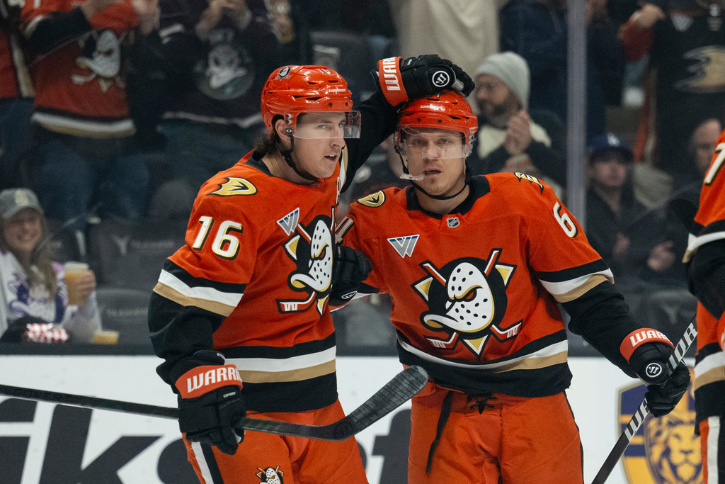 Anaheim Ducks center Ryan Strome (16) and center Mikael Granlund (64) celebrate a goal by Granlund during the first period of an NHL hockey game against the Columbus Blue Jackets, Saturday, Dec. 20, 2025, in Anaheim, Calif. (AP Photo/Kyusung Gong)
