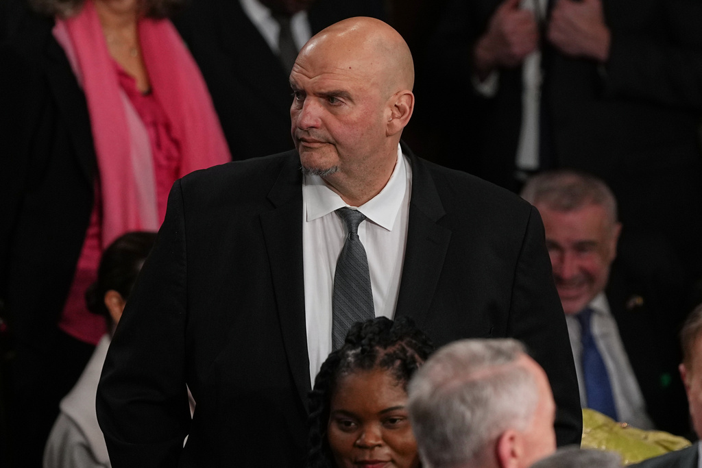 Sen. John Fetterman, D-Pa., arrives before President Donald Trump delivers the State of the Union address to a joint session of Congress in the House chamber at the U.S. Capitol in Washington, Tuesday, Feb. 24, 2026. (AP Photo/Matt Rourke)