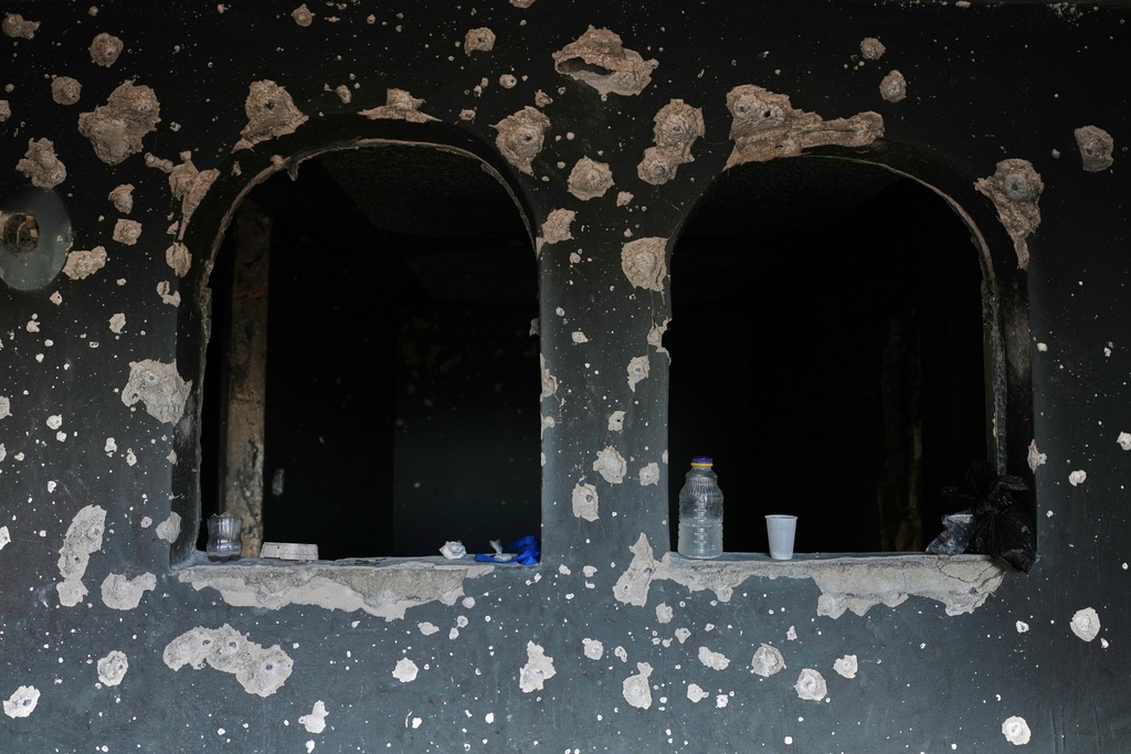 Bullet holes riddle a house in the Solino neighborhood of Port-au-Prince, Haiti, Thursday, March 12, 2026. (AP Photo/Odelyn Joseph)