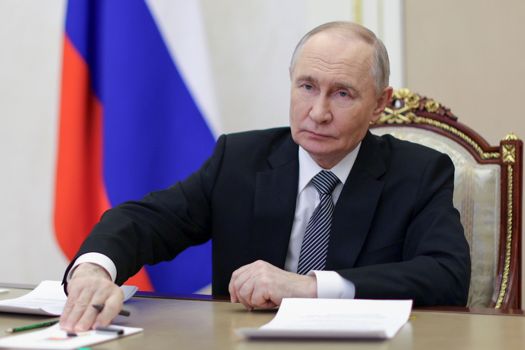Russian President Vladimir Putin attends a meeting of the Presidential Council for the Development of Civil Society and Human Rights via videoconference at the Kremlin in Moscow, on Tuesday, Dec. 9, 2025. (Gavriil Grigorov, Sputnik, Kremlin Pool Photo via AP)