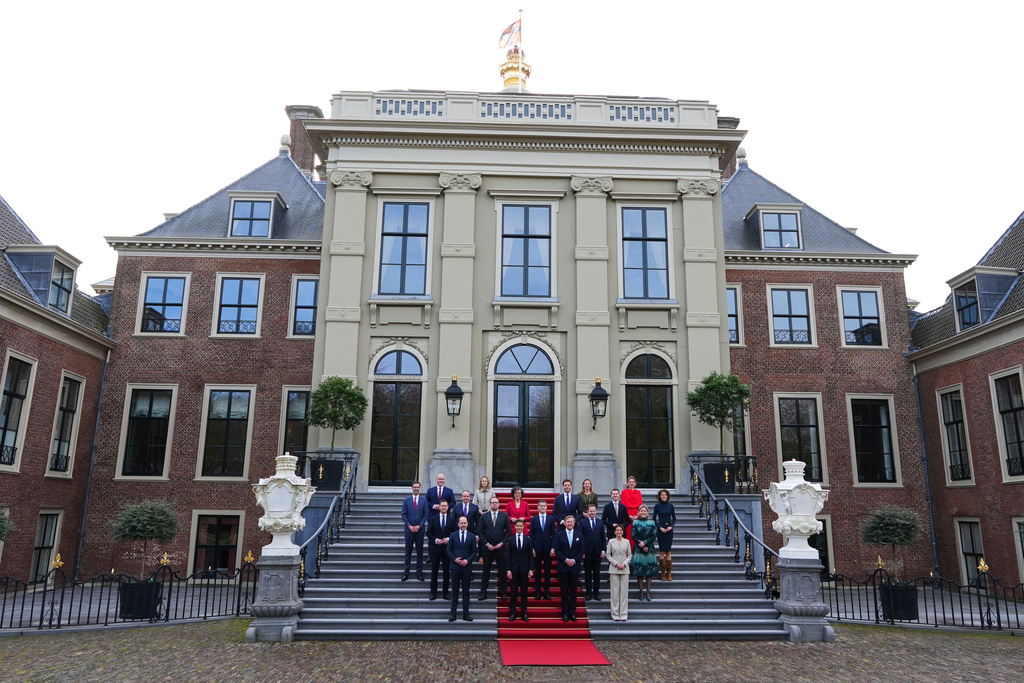 Ministers of the new three-party minority government pose with King Willem-Alexander, center right, prime minster Rob Jetten, center left, and deputy prime minister Dilan Yesilgöz, front row right, on the steps of Royal Palace Huis ten Bosch in The Hague, Netherlands, Monday, Feb. 23, 2026. (AP Photo/Peter Dejong)