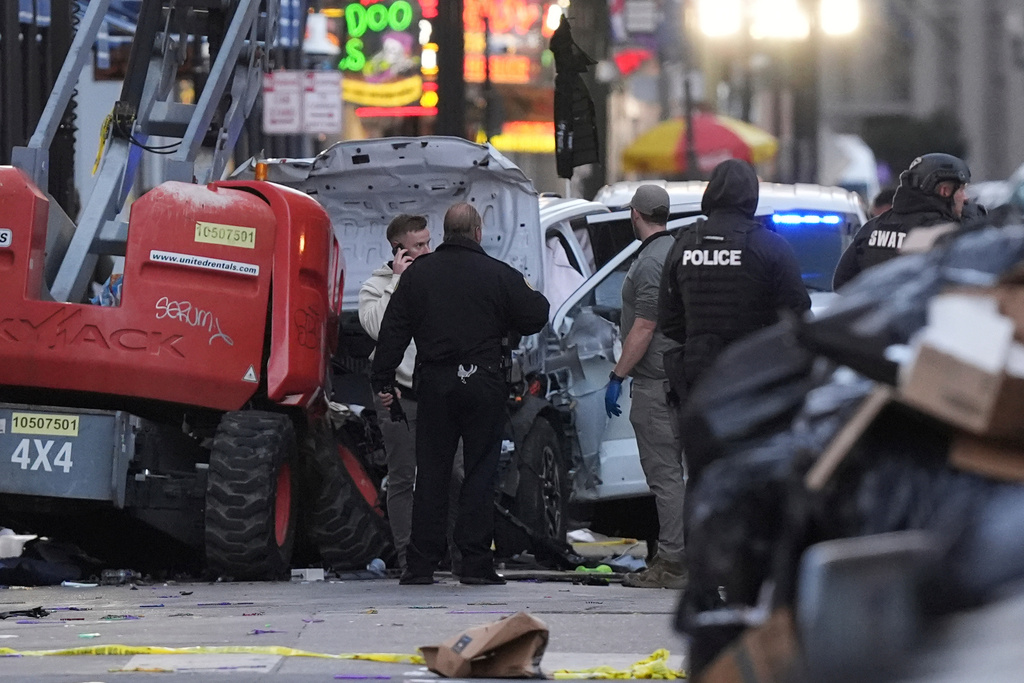 FILE - Emergency personnel work at the scene on Bourbon Street after a vehicle drove into a crowd on New Orleans' Canal and Bourbon Street, Wednesday Jan. 1, 2025. (AP Photo/Gerald Herbert, File)