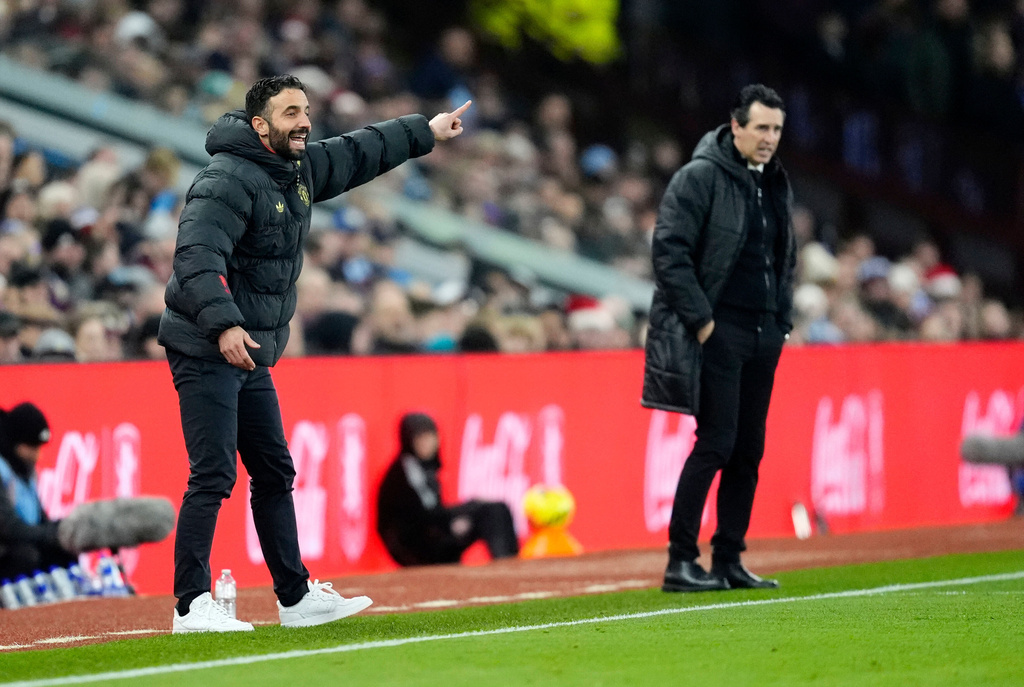 Manchester United manager Ruben Amorim, left, and Aston Villa manager Unai Emery during the Premier League soccer match between Aston Villa and Manchester United, in Birmingham, England, Sunday Dec. 21, 2025. (Nick Potts/PA via AP)