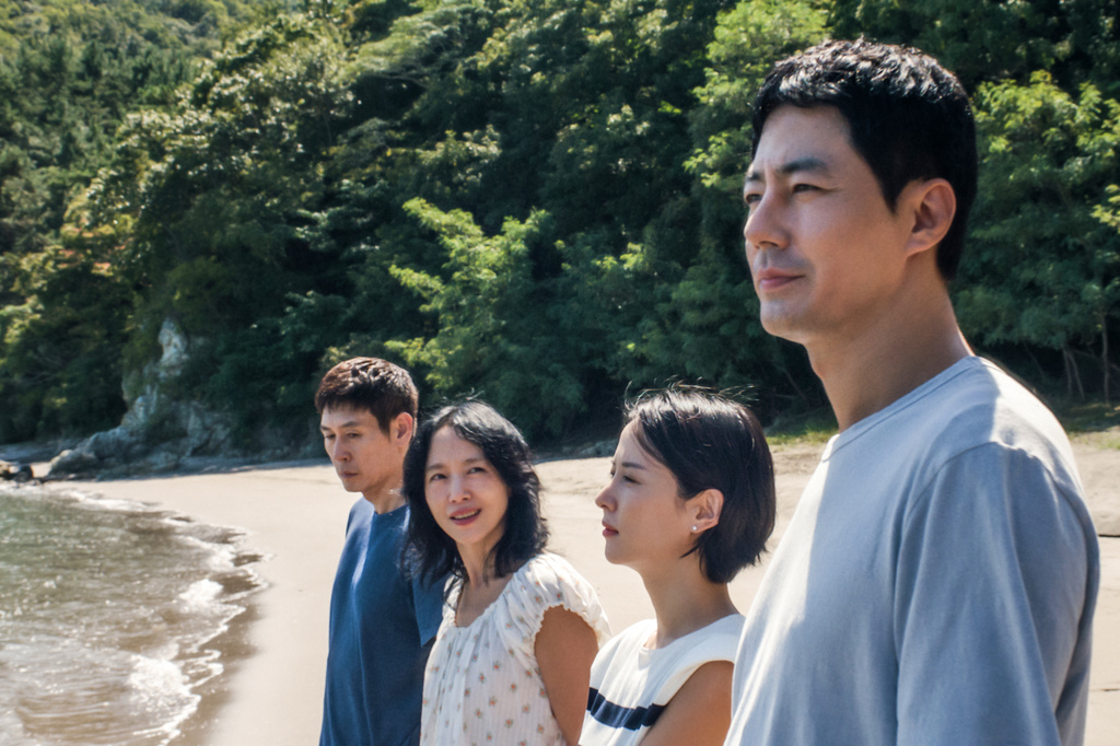 This image released by Netflix shows, from left, Sul Kyung-gu, Jeon Do-yeon, Cho Yeo-jeong, and Zo In-sung in a scene from "Possible Love." (Netflix via AP)