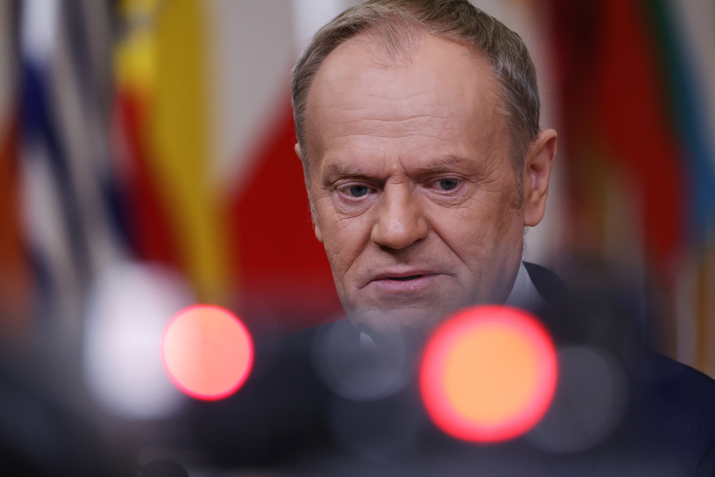Poland's Prime Minister Donald Tusk speaks with the media as he arrives for an EU summit at the European Council building in Brussels, Thursday, Jan. 22, 2026. (AP Photo/Omar Havana)