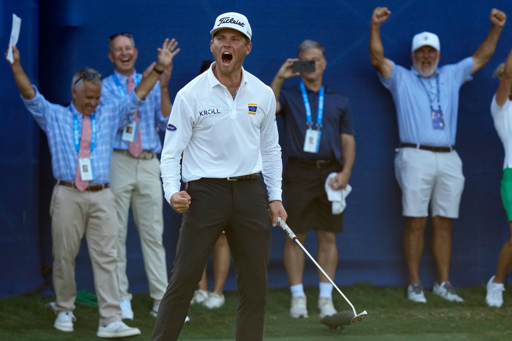 Michael Brennan reacts after winning the Wyndham Championship golf tournament in Greensboro, N.C., Sunday, Aug. 9, 2026. (AP Photo/Chuck Burton)