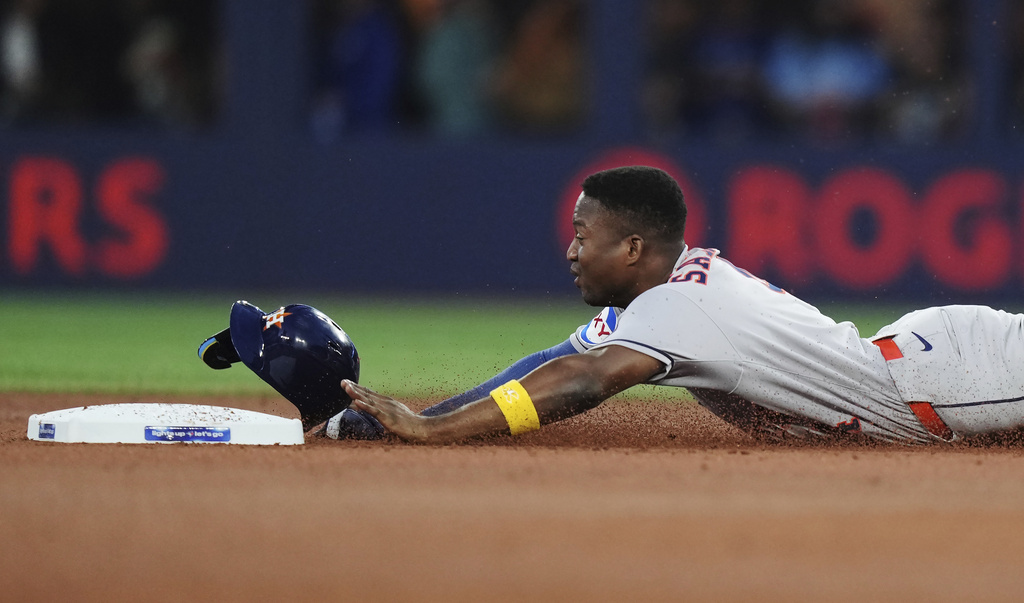 Houston Astros' Jesus Sanchez steals second base against the Toronto Blue Jays during the second inning of a baseball game in Toronto on Wednesday, Sept. 10, 2025. (Nathan Denette/The Canadian Press via AP)