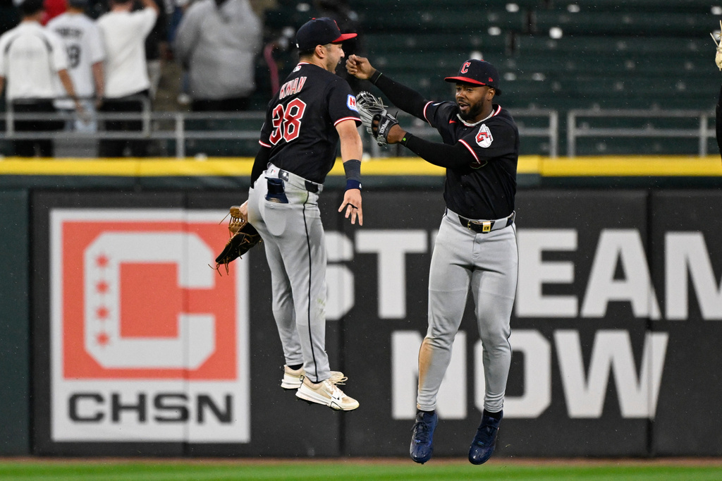 Cleveland Guardians center fielder Steven Kwan, left, and right fielder Kahlil Watson celebrate after a baseball game against the Chicago White Sox, Wednesday, June 24, 2026, in Chicago. (AP Photo/Matt Marton)
