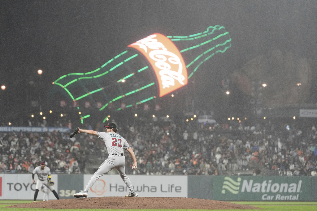 Arizona Diamondbacks pitcher Zac Gallen (23) throws as light rain falls during the fourth inning of a baseball game against the San Francisco Giants in San Francisco, Tuesday, Sept. 9, 2025. (AP Photo/Jeff Chiu)