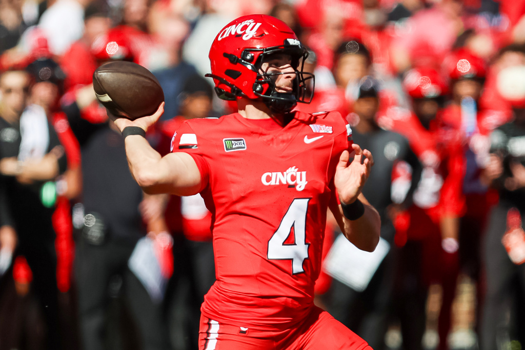 Cincinnati quarterback JC French IV (4) throws a pass during the first half of an NCAA college football game against Texas Tech, Saturday, Oct. 24 2026, in Cincinnati. (AP Photo/Lydia Schembre)