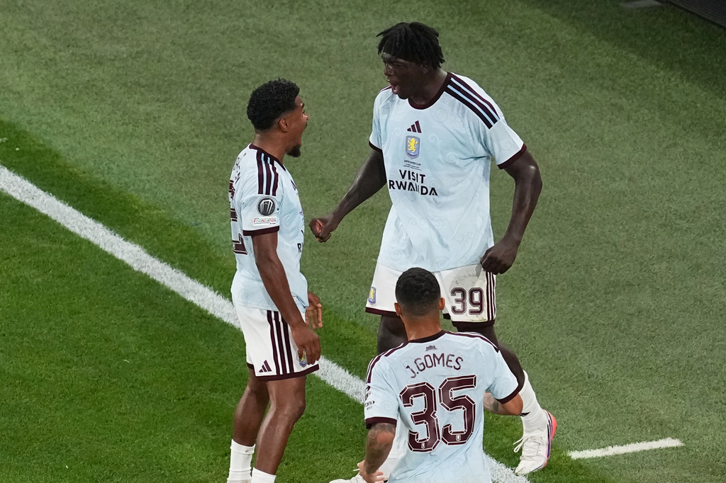 Aston Villa's Brian Madjo, right, celebrates after scoring his side's first goal during the UEFA Super Cup soccer match between Paris Saint-Germain and Aston Villa in Salzburg, Austria, Wednesday, Aug. 12, 2026. (AP Photo/Darko Vojinovic)