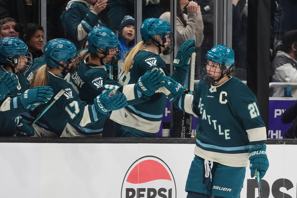 FILE - Seattle Torrent forward Hilary Knight (21) celebrates a goal against the Toronto Sceptres with the bench during the first period of a PWHL hockey game, Jan. 20, 2026, in Seattle. (AP Photo/Lindsey Wasson, File)