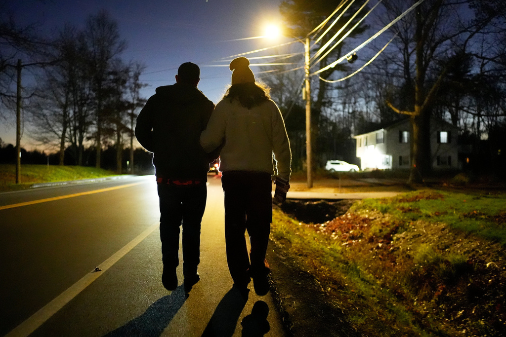 Graham Platner, Democratic candidate for U.S. Senate, and his wife, Amy Gertner, walk together while canvassing for a citizen's initiate on Election Day, Tuesday, Nov. 4, 2025, in Ellsworth, Maine. (AP Photo/Robert F. Bukaty)