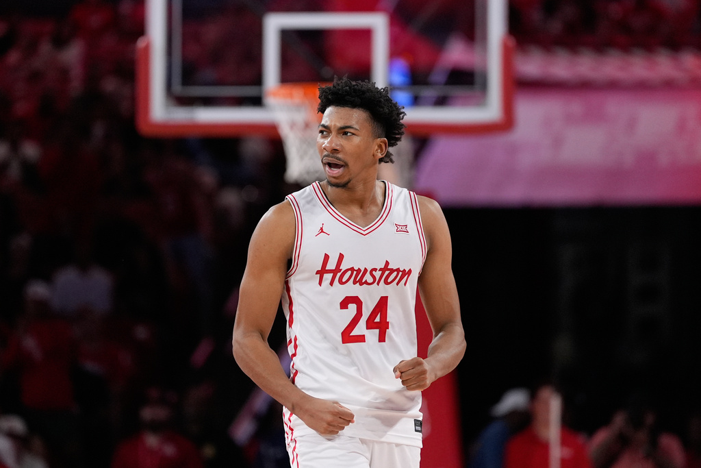 Houston forward Chase McCarty celebrates during the second half of an NCAA college basketball game against Towson in Houston, Saturday, Nov. 8, 2025. (AP Photo/Ashley Landis)
