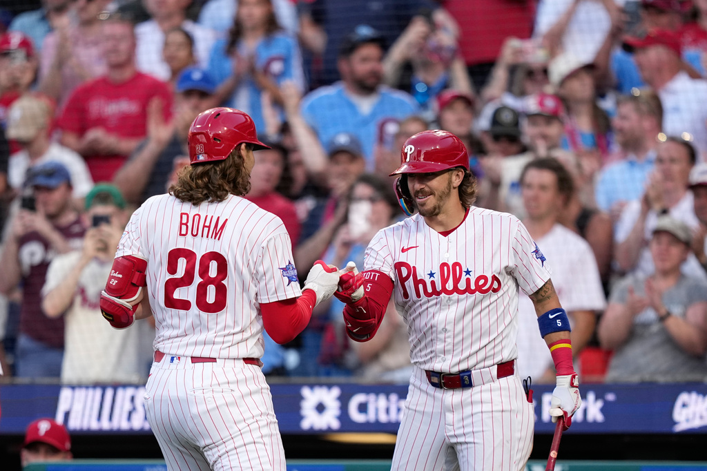 Philadelphia Phillies' Alec Bohm, left, and Bryson Stott celebrate after Bohm's two-run home run against Miami Marlins pitcher Tyler Phillips during the second inning of a baseball game Tuesday, June 16, 2026, in Philadelphia. (AP Photo/Matt Slocum)