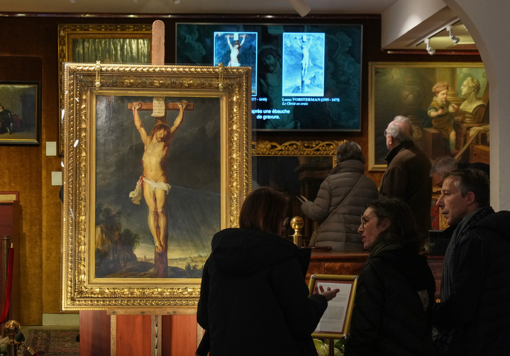 Long-lost painting "Crucifixion of Jesus Christ" by Baroque master Peter Paul Rubens, which was hidden for more than four centuries, is displayed at the auction house Osenat in Versailles, west of Paris, Nov. 30, 2025. (AP Photo/Michel Euler)