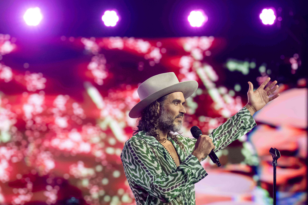 FILE - Russell Brand speaks during Turning Point USA's AmericaFest 2025, Thursday, Dec. 18, 2025, in Phoenix. (AP Photo/Jon Cherry, File)