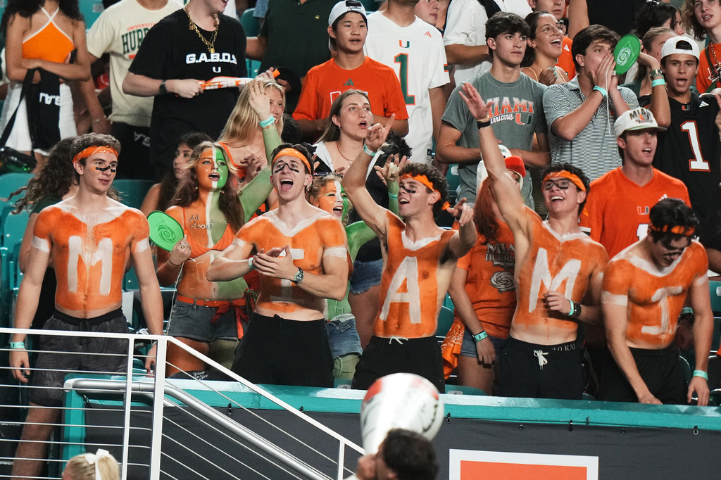 Miami fans cheer during the second half of an NCAA college football game against Florida A&M, Thursday, Sept. 10, 2026, in Miami Gardens, Fla. (AP Photo/Lynne Sladky)