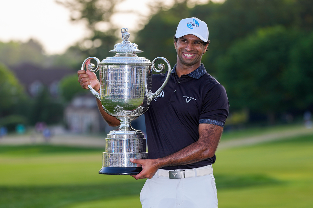 Aaron Rai, of England, holds the Wanamaker Trophy after winning the PGA Championship golf tournament at Aronimink Golf Club, Sunday, May 17, 2026, in Newtown Square, PA. (AP Photo/Matt Slocum)