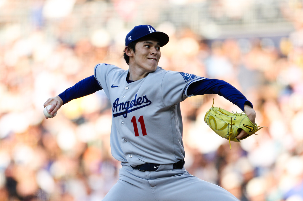 Los Angeles Dodgers' Roki Sasaki delivers a pitch against the San Diego Padres in the first inning of a baseball game Friday, June 26, 2026, in San Diego. (AP Photo/Derrick Tuskan)
