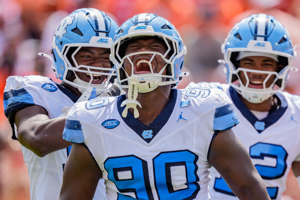 North Carolina defensive lineman Xavier Lewis (90) reacts after a sack against Clemson in the first half of an NCAA college football game Saturday, Sept. 19, 2026, in Clemson, S.C. (AP Photo/Jacob Kupferman)