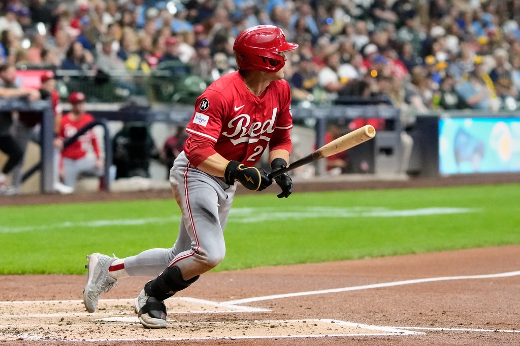 Cincinnati Reds' TJ Friedl hits a double during the third inning of a baseball game against the Milwaukee Brewers Friday, Sept. 26, 2025, in Milwaukee. (AP Photo/Morry Gash)