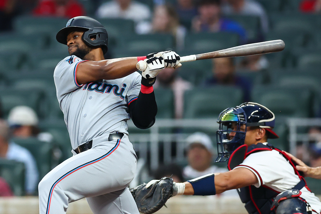 Miami Marlins' Otto Lopez hits an RBI single in the fourth inning of a baseball game against the Atlanta Braves, Monday, April 13, 2026, in Atlanta. (AP Photo/Colin Hubbard)