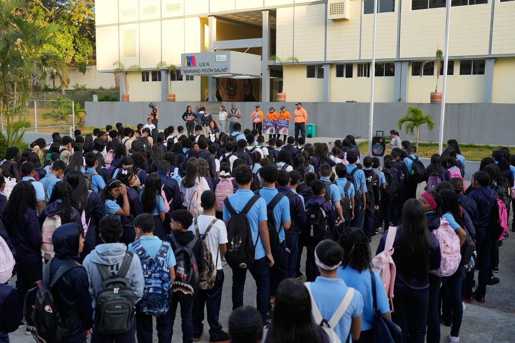 Children return to school after the holiday break in Caracas, Venezuela, Monday, Jan. 12, 2026. (AP Photo/Matias Delacroix)