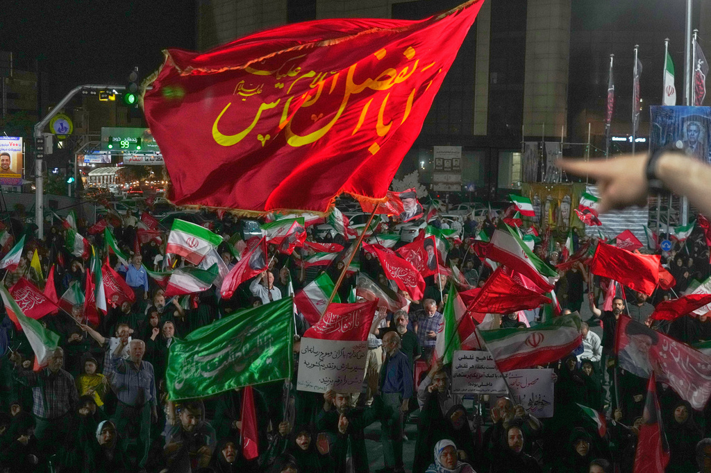 Pro-government demonstrators gather at a square in Tehran, Friday, July 17, 2026. (AP Photo/Vahid Salemi)