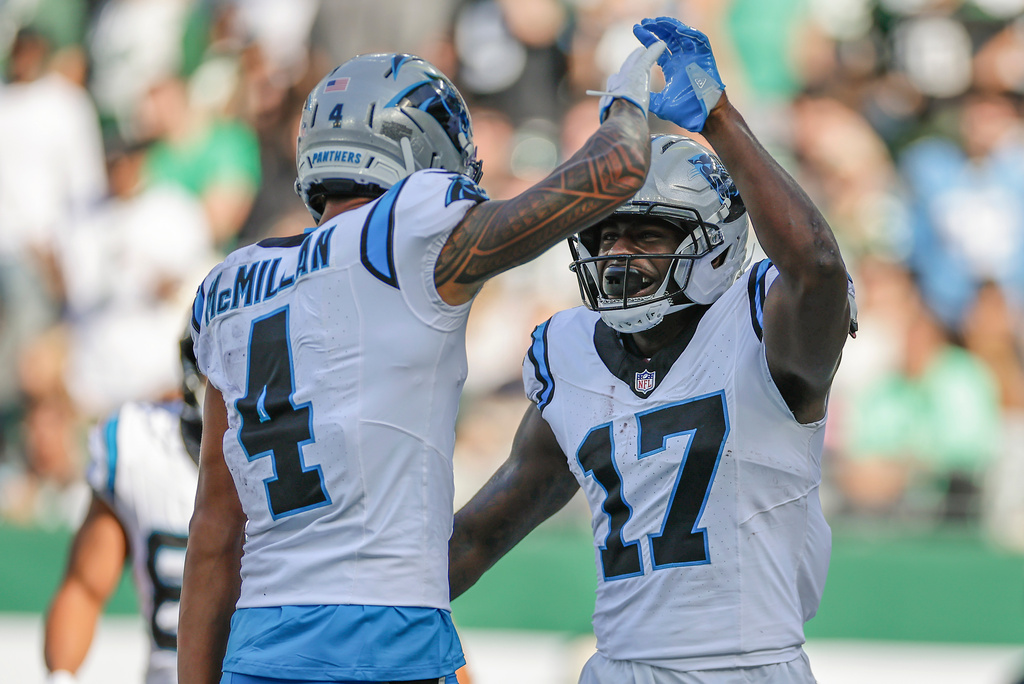 Carolina Panthers wide receiver Xavier Legette (17) celebrates with wide receiver Tetairoa McMillan (4) after scoring a touchdown against the New York Jets during the second quarter of an NFL football game, Sunday, Oct. 19, 2025, in East Rutherford, N.J. (AP Photo/Adam Hunger)