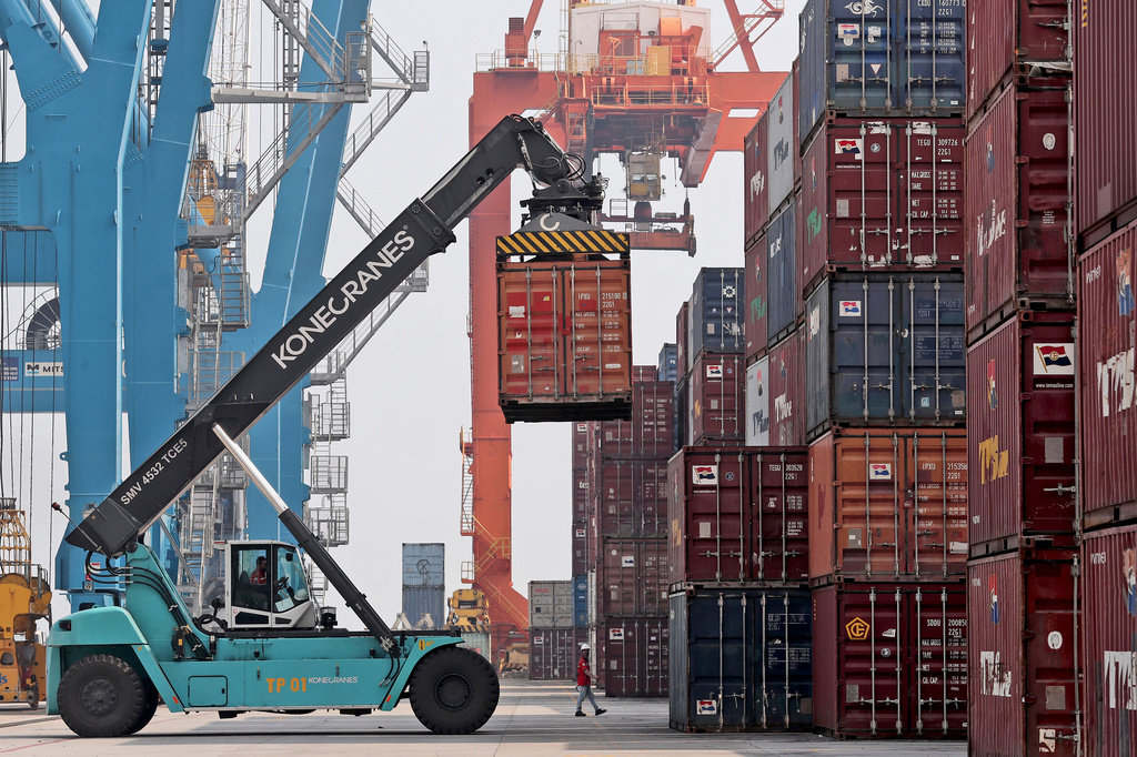 FILE - A stacker organizes containers at the terminal of Indonesia Port Corporations at the container Tanjung Priok Port in Jakarta, Indonesia, on Oct. 8, 2021. (AP Photo/Tatan Syuflana, File)