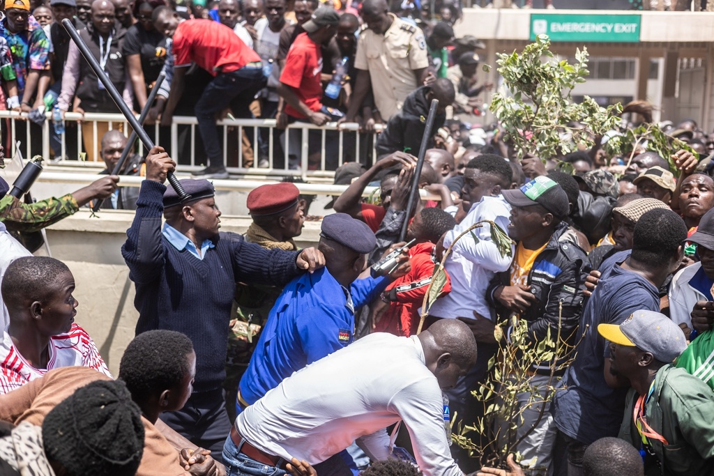 Supporters get caught in a stampede at the State Funeral for former Kenya prime minister Raila Odinga at Nyayo National Stadium in Nairobi, Kenya, Friday, Oct. 17, 2025. (AP Photo/Samson Otieno)